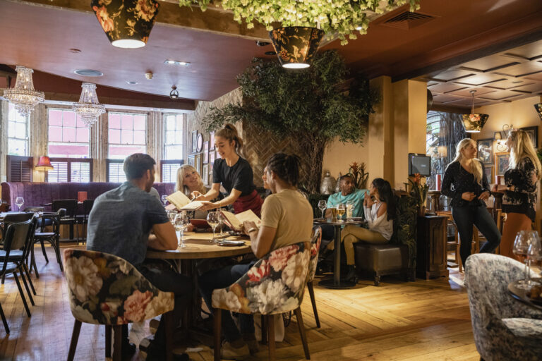 A wide shot of people dining at a restaurant in Newcastle-upon-Tyne.